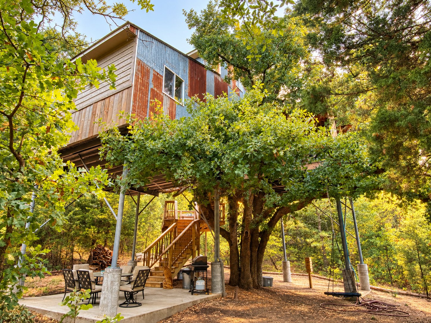 Upward Treehouse and its patio under the oak